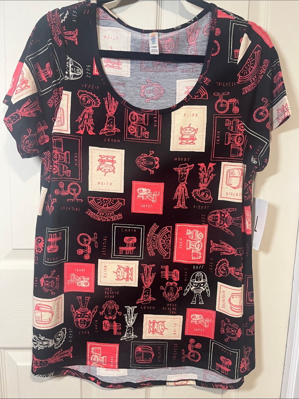 LuLaRoe Short Sleeve Tee in Black with Red & Cream Toy Print